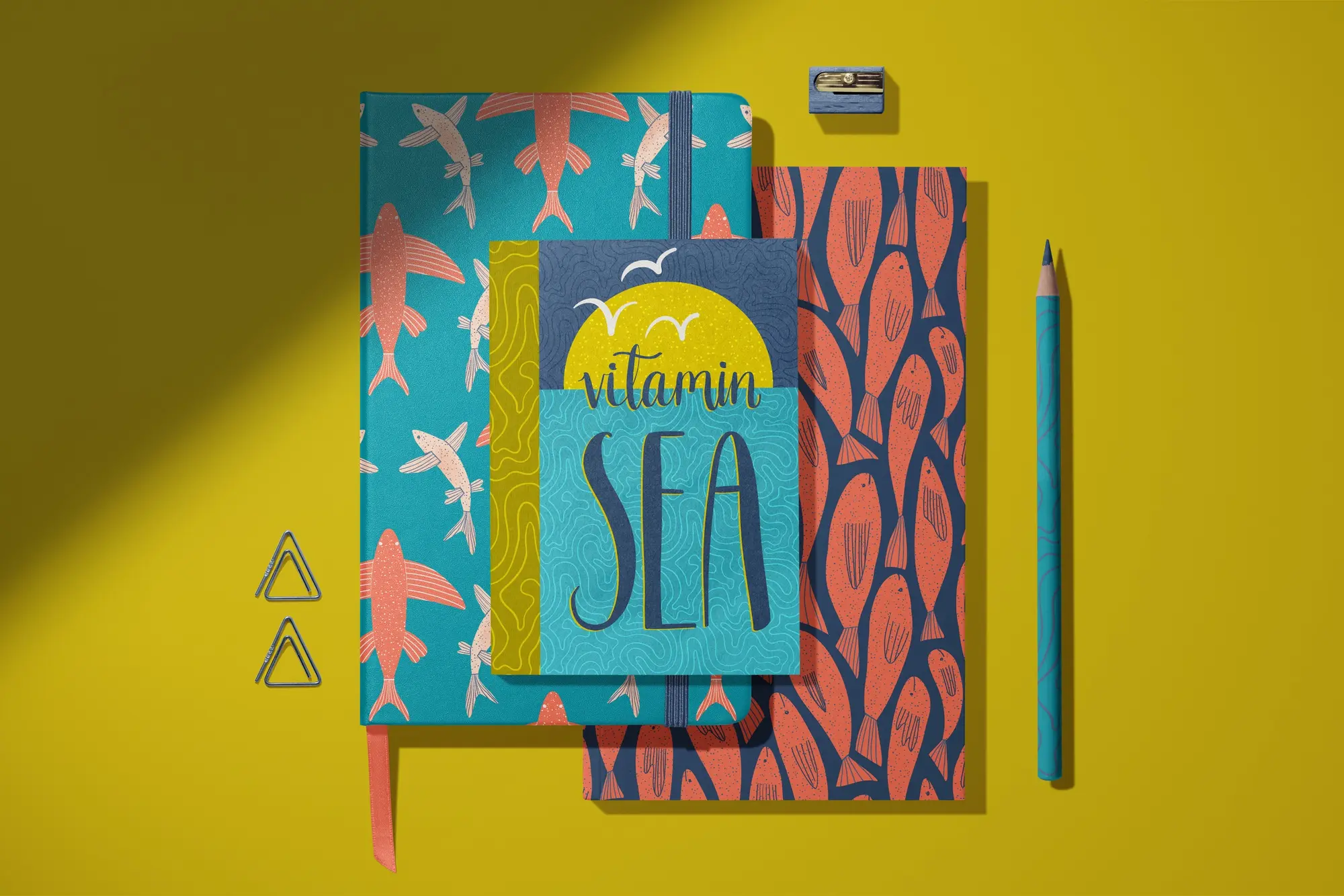 Vitamin Sea notebooks with flying fish and coral fish patterns